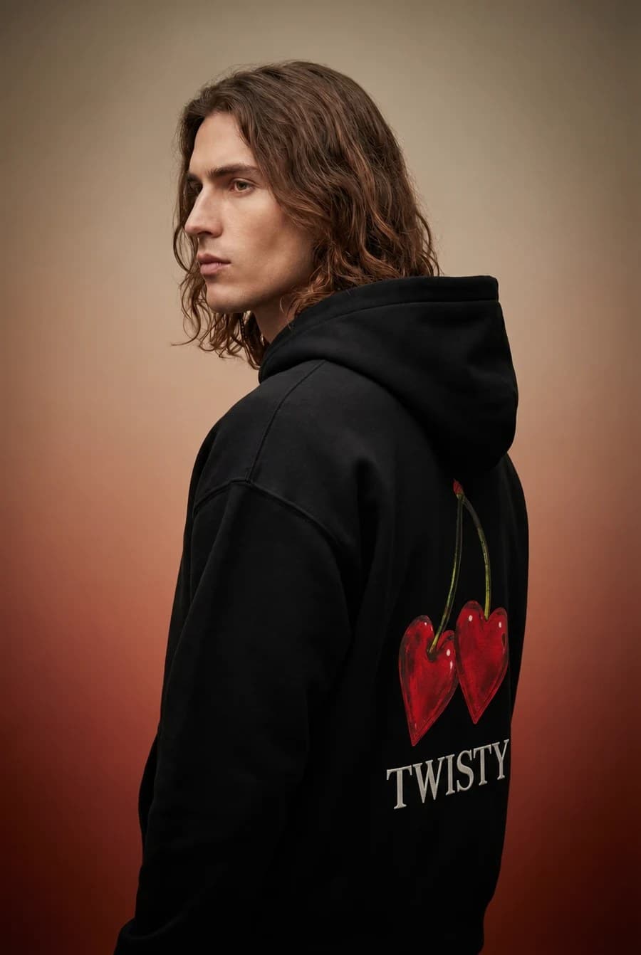 Twisty fashion campaign on a warm studio backdrop